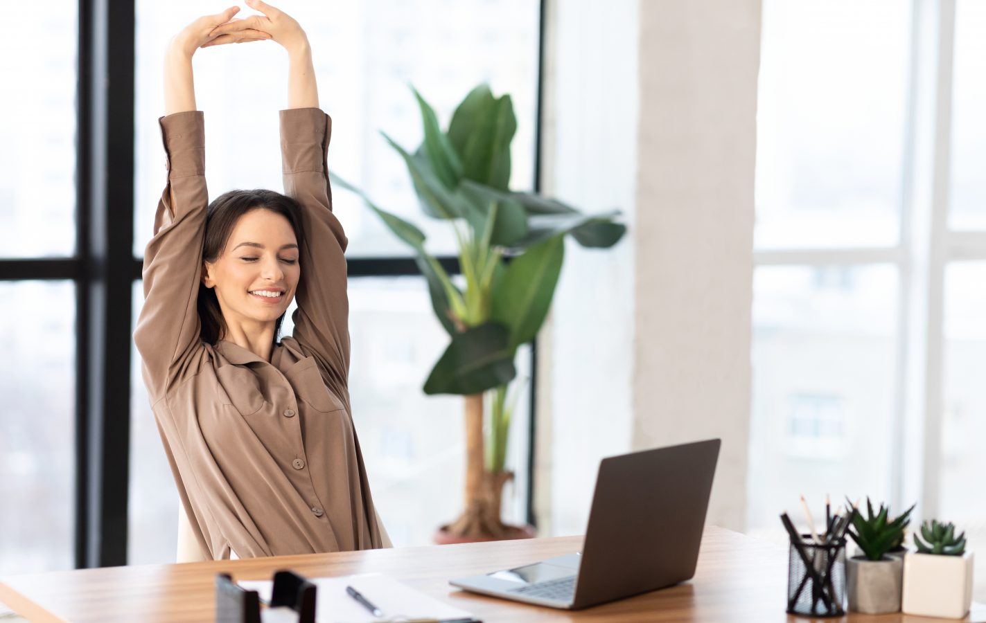 Stress,Relief.,Smiling,Young,Student,Is,Relaxing,At,Workspace,And